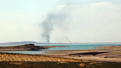 August 18, 2014: Smoke rising during airstrikes targeting ISIL at the Mosul Dam. AP Photo
