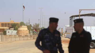 Iraqi officers stand at the Karameh-Turabil border crossing after a special ceremony attended by Jordanian and Iraqi senior officials to mark its reopening on August 30, 2017. Salah Malkawi / Getty Images