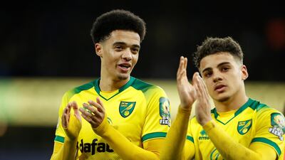Norwich City's Jamal Lewis and Max Aarons applaud fans after the match. Reuters