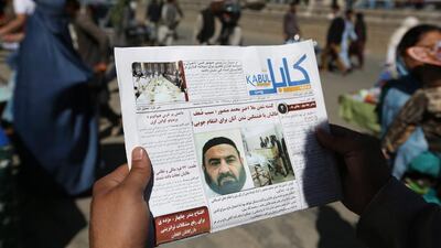 An Afghan man reads a local newspaper with photos of the Afghan Taliban's former leader, Mullah Akhtar Mansoor, who was killed in a US drone strike last week. Rahmat Gul/AP Photo
