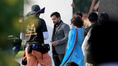 Bollywood actors Emraan Hashmi and Vidya Balan on the set of the Bollywood movie Hamari Adhuri Kahani at the Miracle Garden in Dubai . Satish Kumar / The National