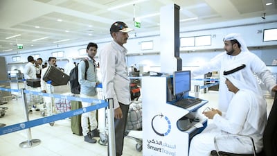 Passengers register for the smart travel programme. The smart travel system will decrease processing times within the airport by up to 70 per cent, meaning less time in queues for travellers. Christopher Pike / The National