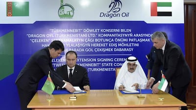 Dragon Oil's Ali Al Jarwan, right, and Turkmen Oil's Guvanch Agadzhanov during the signing ceremony. Wam