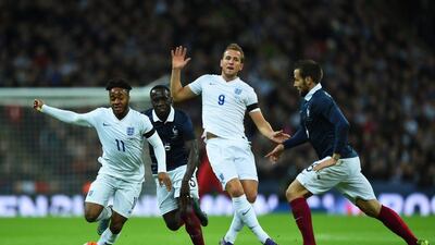Raheem Sterling, left, and Harry Kane of England, Bacary Sagna and Yohan Cabaye of France compete for the ball. Shaun Botterill / Getty Images