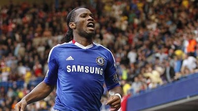 Chelsea's Ivory Coast footballer Didier Drogba celebrates scoring his goal against Arsenal during a Premier League match at Stamford Bridge in London, England on October 3, 2010. AFP PHOTO/IAN KINGTON FOR EDITORIAL USE ONLY Additional licence required for any commercial/promotional use or use on TV or internet (except identical online version of newspaper) of Premier League/Football League photos. Tel DataCo +44 207 2981656. Do not alter/modify photo.