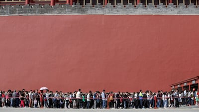 Tourists wait to visit the Forbidden City in central Beijing, China, on China's 68th National Day. Jason Lee / Reuters