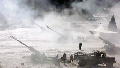 The South Korean army's 155mm howitzers fire yesterday during a drill near the demilitarised zone that seperates the two Koreas. Lee Hae-yrong, Yonhap / AP