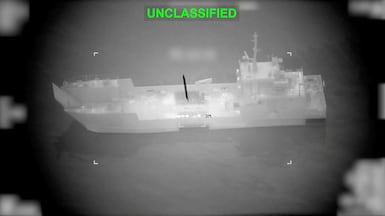 A projectile approaches what US Central Command says is an Iranian naval vessel, during strikes that included attacks on mine-laying vessels, at a location given as near the Strait of Hormuz. Reuters