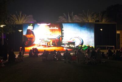 Movie goers watch a film in Umm Al Emarat Park.
