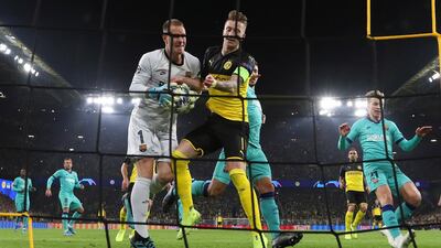 Dortmund's Marco Reus collides with Barcelona's goalkeeper Marc-Andre ter Stegen. EPA