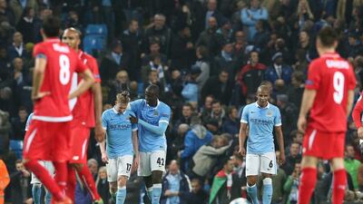 Manchester City’s Yaya Toure congratulates Kevin de Bruyne during their Champions League win over Sevilla on Wednesday at the Etihad Stadium. Nigel Roddis / EPA