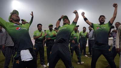 Pakistan players celebrate after winning the third and final T20 against Sri Lanka at Gaddafi Stadium in Lahore. Aamir Qureshi / AFP
