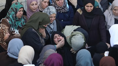 Palestinian relatives of Yazan Abu Tabekh, 19, weep during his funeral in the west bank city of Jenin. Abu Tabekh and other Palestinian policeman were shot killed by Israeli forces after Israeli forces demolished a Palestinian house in the Jenin. Seven other Palestinians were wounded during the clashes. EPA
