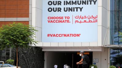 A billboard in Business Bay, Dubai, encouraging people to get vaccinated. Chris Whiteoak / The National.