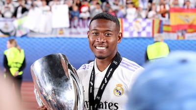 David Alaba of Real Madrid holds the trophy after winning the Uefa Super Cup final. EPA