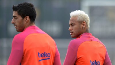 Barcelona's Brazilian forward Neymar, right, and teammate Luis Suarez arrive before a training session at the Sports Center FC Barcelona Joan Gamper in Sant Joan Despi, near Barcelona on September 20, 2016 Josep Lago / AFP