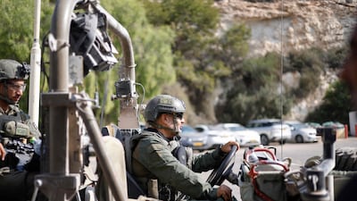Israeli troops drive along the road as they prepare to enter south Lebanon, in Rosh HaNikra, northern Israel last month. AFP
