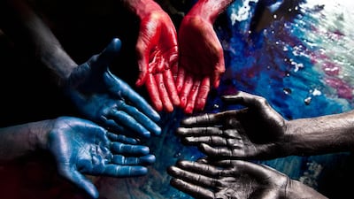 In 'Family Portrait', Kristine depicts how slavery can last through generations. The dyed black hands are of the father's, and the blue red and hands are his sons's. Using their bare hands, these silk dyers in an Indian village dip the cloth in barrels filled with toxic dye.
