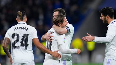 Real Madrid's Luka Modric, centre, is congratulated by teammates. AP Photo