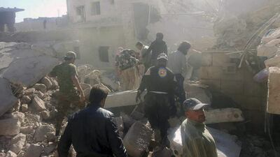 The Syrian Civil Defence and citizens search the rubble of buildings hit by air strikes in Darat Izza town, in rural western Aleppo province, on November 5, 2016. Syrian Civil Defense White Helmets via AP