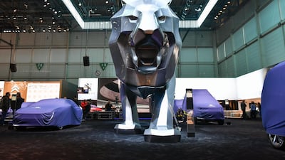 Covered cars a the stand of French car maker Peugeot at the Geneva International Motor Show 2018. The French makes owner PSA has signed a joint venture with Japanese electric motor maker Nidec. Harold Cunningham/AFP