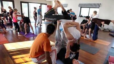 Acro yoga, which combines acrobatics, yoga and Thai massage, is gaining popularity in the UAE. Dolores Johnson / The National