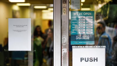 A notice informing people of closure is seen inside the doorway of a Thomas Cook store in London, Britain. Reuters