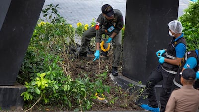 Thai investigators examine a site of one of several small explosions thta hit Bangkok early on August 2, 2019. AP Photo