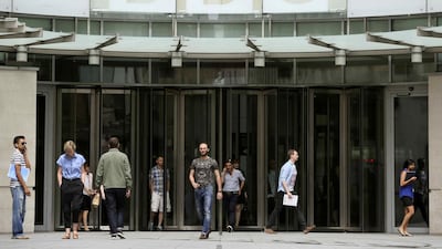People arrive and depart from Broadcasting House, the headquarters of the BBC, in London on July 2. Raul Hackett / Reuters