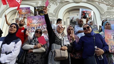 Supporters of the Tunisian National Salvation Front opposition coalition carry placards with photos of political prisoners during a protest in Tunis last month. EPA