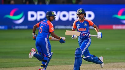 India's captain Harmanpreet Kaur, right, and teammate Deepti Sharma take a run. AFP