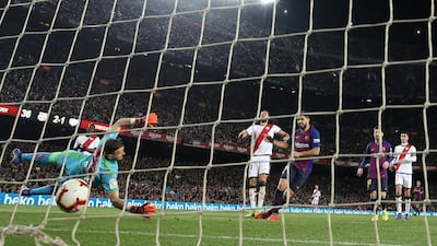 Barcelona's Luis Suarez scores their third goal. Reuters