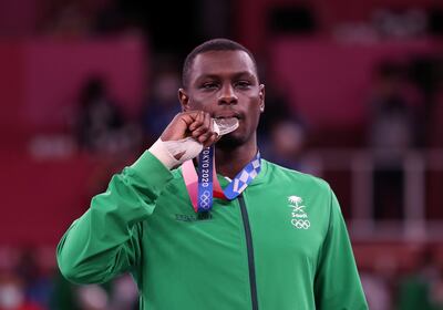 Silver medalist Tareq Hamdi of Saudi Arabia poses with his medal during the medal ceremony for the men's kumite +75kg. EPA