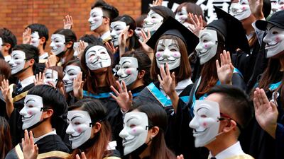 University students wearing Guy Fawkes masks pose for a photoshoot of a graduation ceremony to support anti-government protests at the Hong Kong Polytechnic University, in Hong Kong, China. Reuters