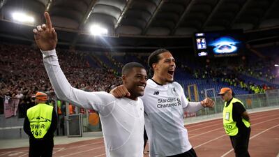 Liverpool's Georginio Wijnaldum, left, and Virgil Van Dijk celebrate at the end of the Champions League semi-final against Roma. AP/Alessandra Tarantino