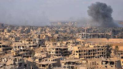 Smoke billows from an explosion in Deir Ezzor during an assault by Syrian government forces against ISIL positions in the city on November 2, 2017. AFP