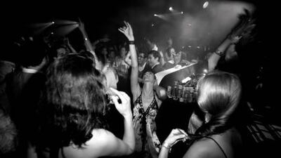 Party-goers live it up at the exclusive Amber Lounge, one of many hip parties that will be drawing the crowds during this weekend's event-packed Abu Dhabi Grand Prix.