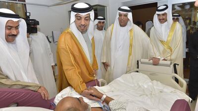 Sheikh Mansour shakes the hand of a patient during the tour of the 248-bed hospital.