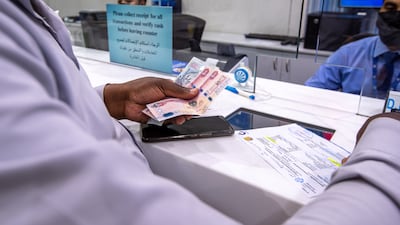 Growth of remittances to poor and middle-income countries is expected to slow to 3.1 per cent in 2024, the World Bank said. Victor Besa / The National