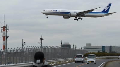 An ANA aircraft approaches to land at Narita Airport in Narita, Chiba Prefecture, Japan. Akio Kon/Bloomberg