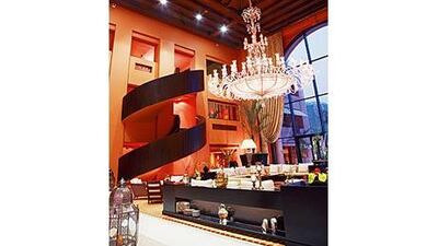 The Sofitel El Gezirah hotel features a spacious lounge area decorated with a mix of modern and traditional motifs.