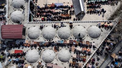 An aerial view of worshippers gathering for the first Friday prayers of Ramadan, outside the Ulu Grand Mosque in Kahramanmaras, southern Turkey. The mosque was damaged in February's earthquake, in which more than 50,000 people died in Turkey and Syria. EPA