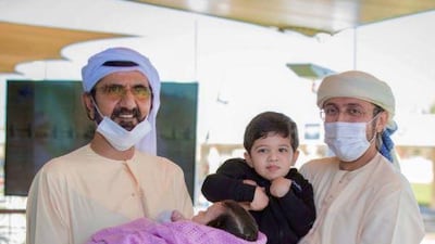 Sheikh Mohammed bin Rashid pictured with son-in-law Sheikh Faisal Saud Khalid Al Qasimi. Sheikh Faisal holds his son Mohammed bin Faisal, who was born in 2018, and the Dubai Ruler holds his second child. Courtesy: Sheikh Faisal Instagram