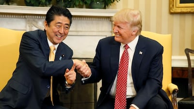 Japanese Prime Minister Shinzo Abe shakes hands with US President Donald Trump during their meeting in the Oval Office on February 10, 2017. Reuters
