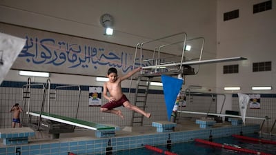 Nasser Al Ahbadi, 7, drops all technique at one of his regular practice sessions in the Al Ain Swimming Team pool.