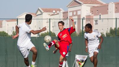 An action from last year’s Dubai Schools Football Cup quarter-final match between Sabis Choueifat School, in red, and Rashid bin Saeed School. This year’s tournament features more than 125 teams and will start on Saturday. Duncan Chard for The National
