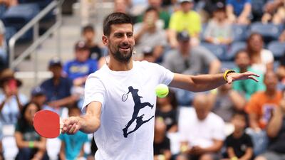 Novak Djokovic plays with a table tennis bat during Arthur Ashe Kids' Day at USTA Billie Jean King National Tennis Center. AFP