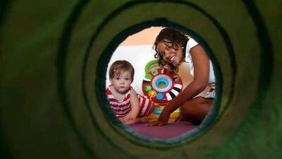 Erica Zentner, with her 13-month-old daughter, Marley. For Erica, her career was too big a part of her identity to give up when she became a mother. She returned to work when her child was four months old. Delores Johnson / The National