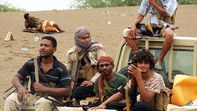 Yemeni government forces ride on the back of a pick-up truck during the battle for Hodeidah against the Houthi rebels. EPA
