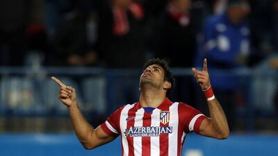 Atletico Madrid striker Diego Costa celebrates scoring a goal against Granada on Wednesday. Sergio Perez / Reuters / March 26, 2014
